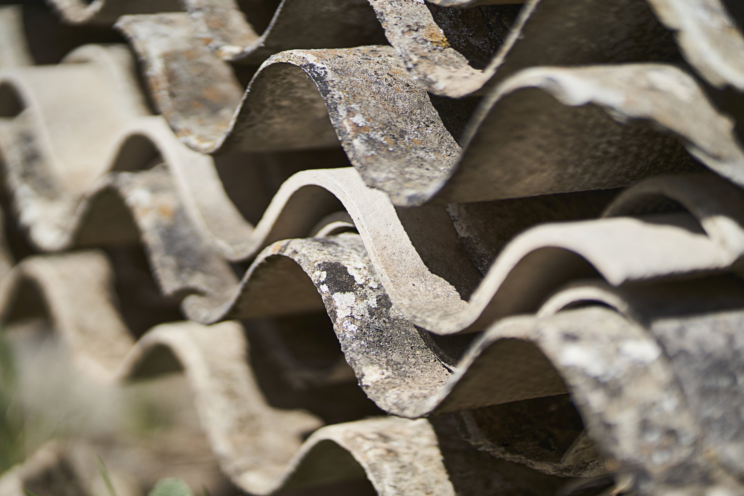 toxic waste with asbestos from piled-up asbestos sheets